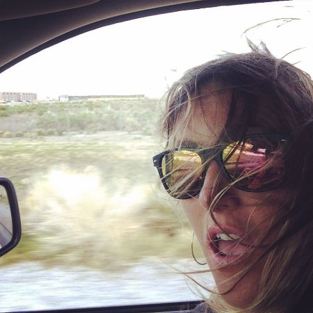 Misty Raney is travelling on her car. 